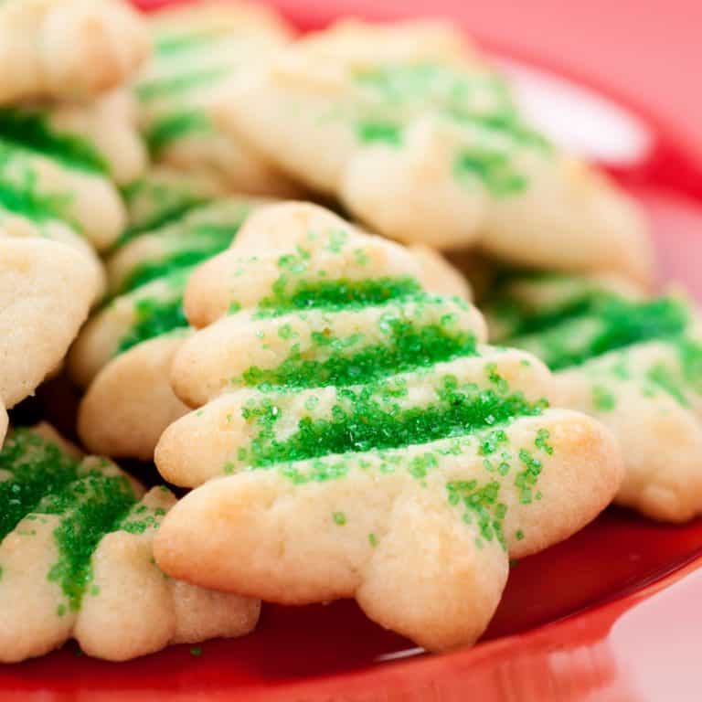 Christmas tree cookies on a red plate